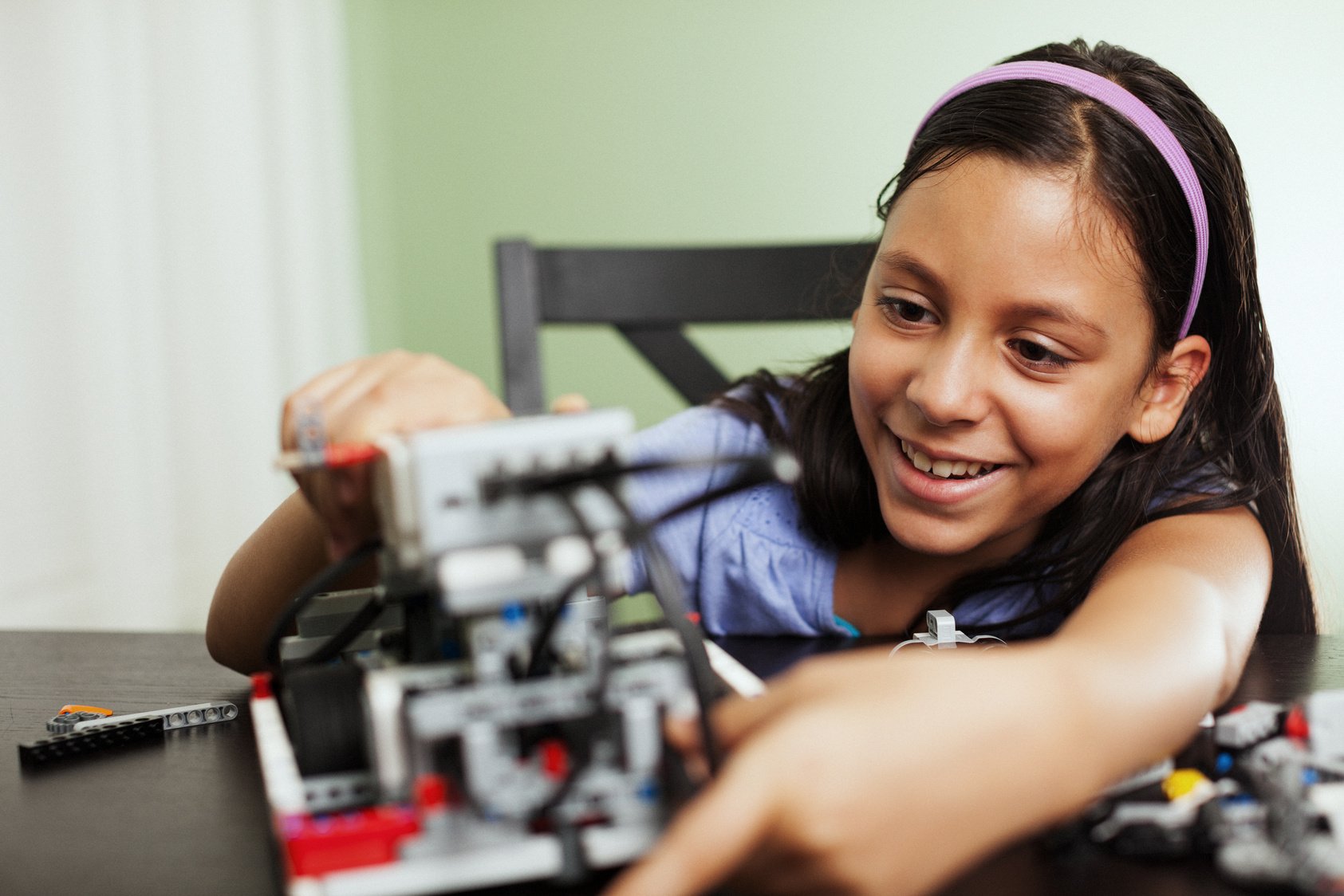 child working with robotics